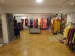 Showroom with Racks and Brown Tiled Flooring by Rohit Mangal Singla Contemporary | Interior Design Photos & Ideas