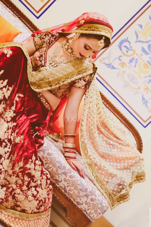Bride Wearing A Classic Red Lehenga by Arjun Mahajan Bridal-jewellery-and-accessories Wedding-photography Wedding-dresses Bridal-makeup | Weddings Photos & Ideas