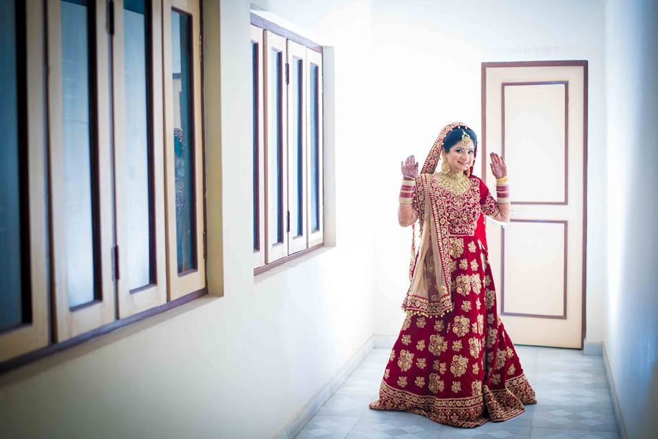 Crimson Shaded Bridal Lehenga With Gold Work by Saurabh Wedding-photography Wedding-dresses | Weddings Photos & Ideas