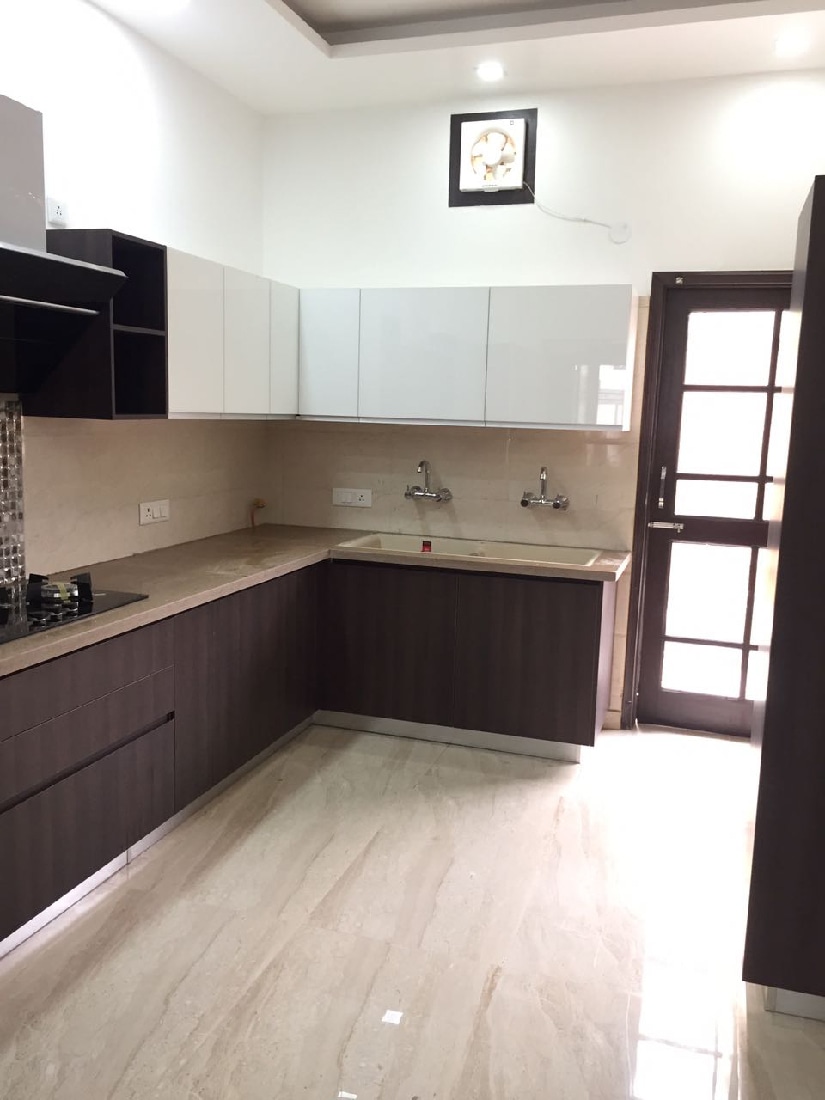 L-shaped modular kitchen design with wooden finish cabinets by Interior Design Modular-kitchen | Interior Design Photos & Ideas