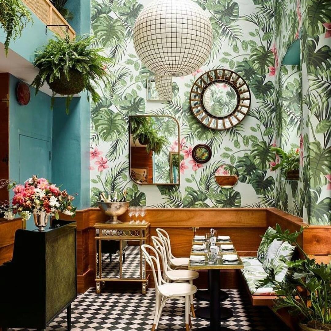 Dining Room With Wooden Table And White Chairs And Planetary String Lights by Nishtha Nayyar Dining-room Contemporary | Interior Design Photos & Ideas