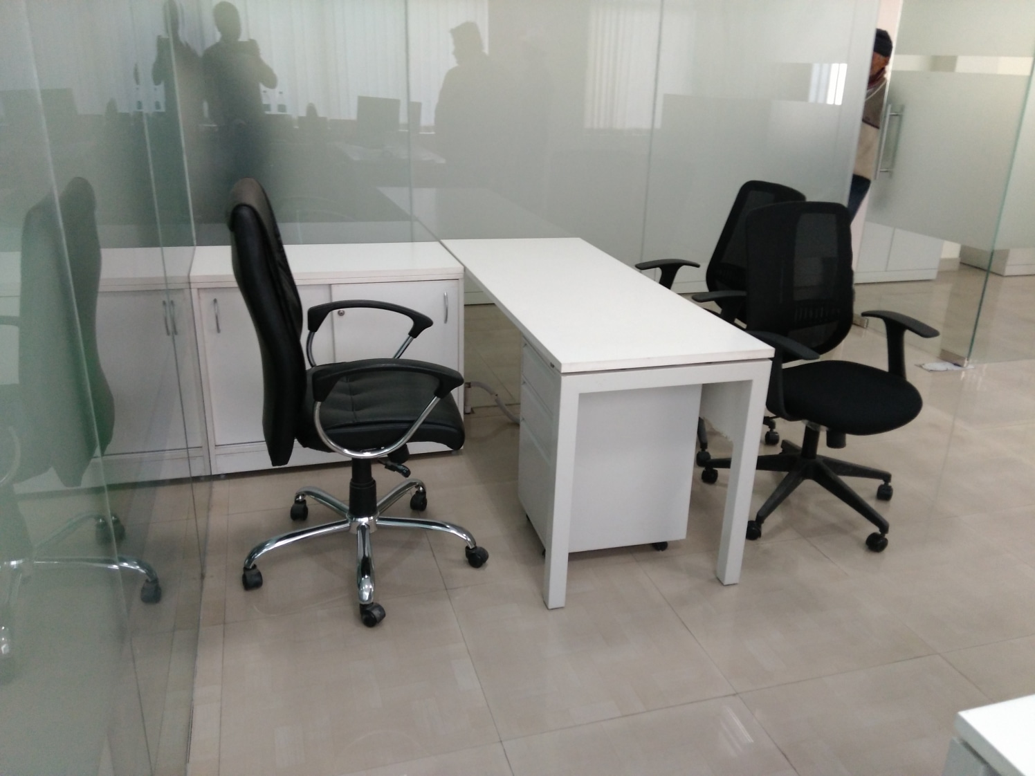 Meeting Room With White Table And Black Chair by Abhinav Jain | Interior Design Photos & Ideas