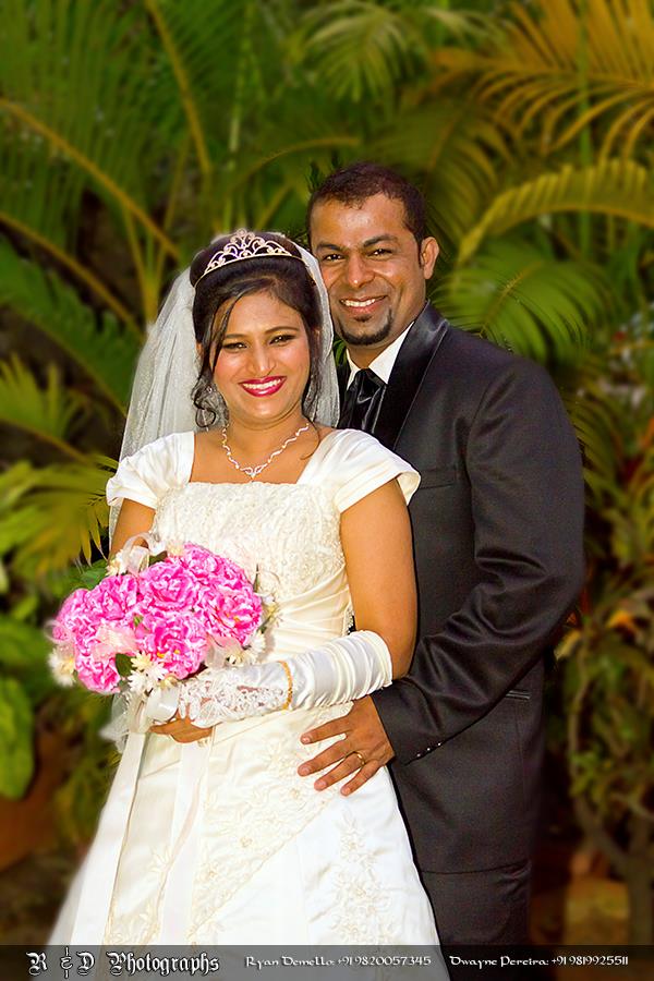 Christian Bride and Groom Holding Pink Flowers by Ryan Demello Wedding-photography | Weddings Photos & Ideas