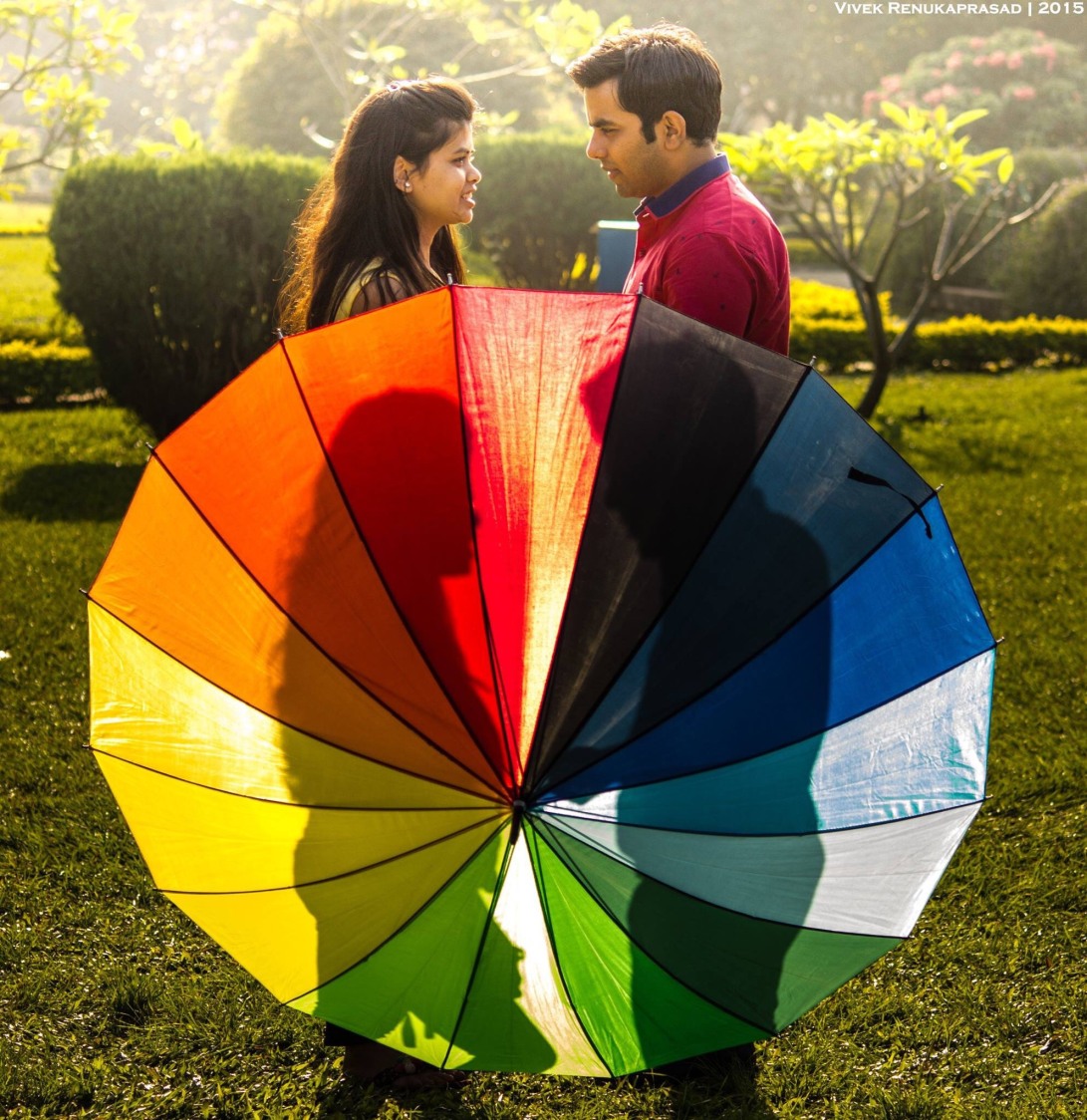 Bride and Groom To-Be Pose With Colourful Umbrella by Vivek Renukaprasad Wedding-photography | Weddings Photos & Ideas