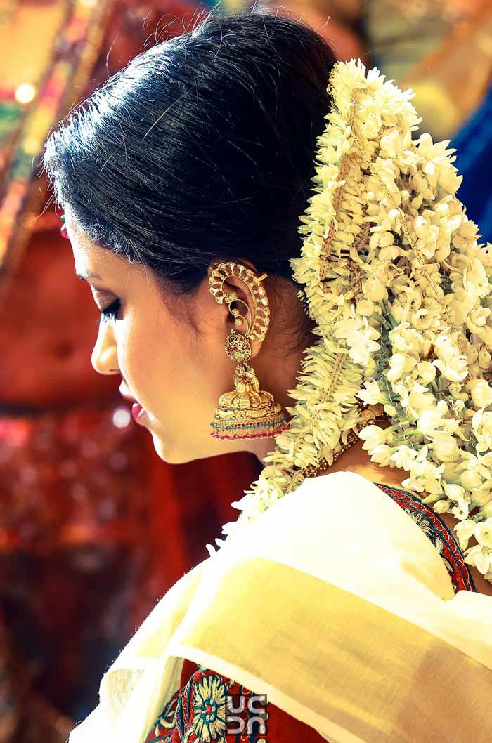 Stunning gajra hairtsyle and gold earrings by Madhuri Sharma Photography Wedding-photography | Weddings Photos & Ideas