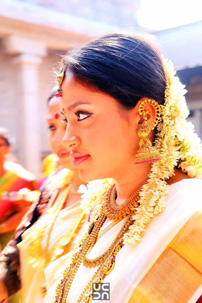 Mesmerising bride with gajra hairstyle and intricate gold earrings by Madhuri Sharma Photography Wedding-photography | Weddings Photos & Ideas