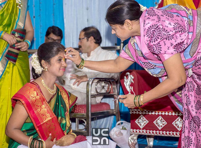 Bride receiving blessings by Madhuri Sharma Photography Wedding-photography | Weddings Photos & Ideas