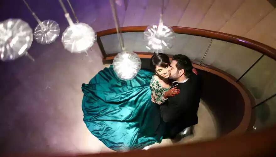 Bride and Groom Striking a Romantic Pose During Their Reception by Rajesh Wedding-photography | Weddings Photos & Ideas