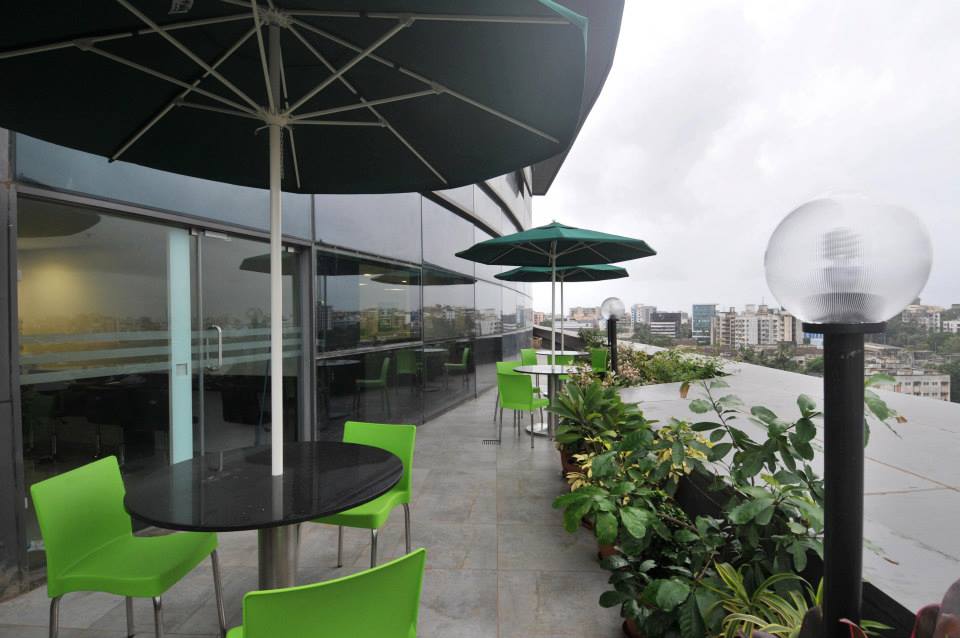 Open Terrace Restaurant With Round Table And Green Chair by Hoshedaar Eruch Carnac Contemporary | Interior Design Photos & Ideas