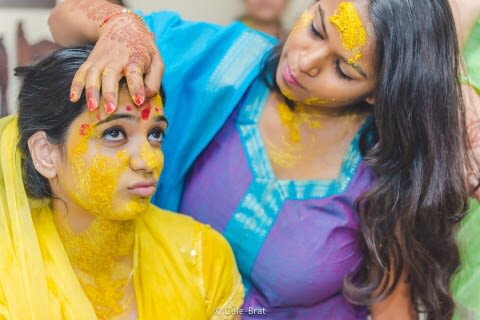 Candid pose of the bride during haldi cermony by Cele-brat Wedding-photography | Weddings Photos & Ideas