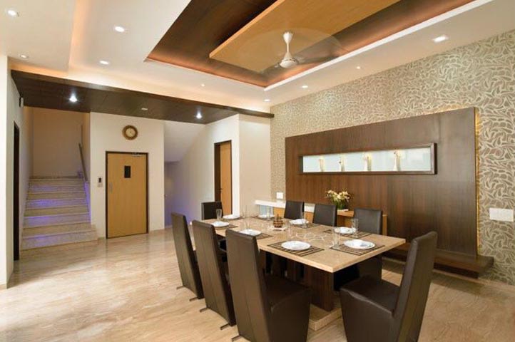 Dining Area With Dark Chocolate High Back Chairs And False Ceiling by Ar.Nitin j Kshirsagar Dining-room Contemporary | Interior Design Photos & Ideas