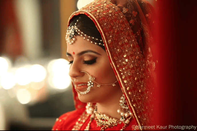 Bride Adoring Gold Nath by Harmeet Kaur Wedding-photography Bridal-jewellery-and-accessories | Weddings Photos & Ideas