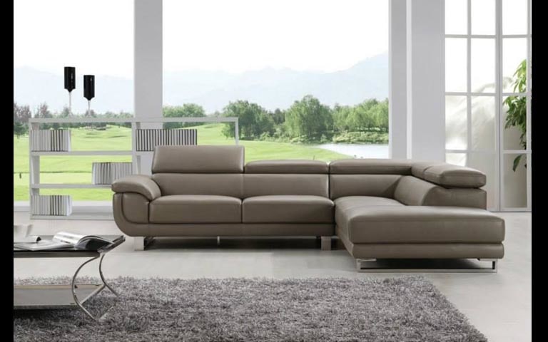 Spacious Living Area With Sectional Sofa And Rough Fibre Rugs by Swagita Living-room Modern | Interior Design Photos & Ideas