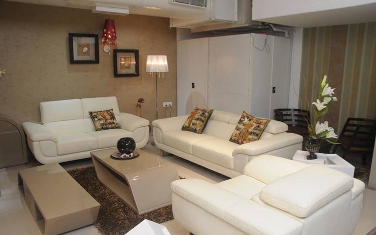 Living Room With White Tufted Sofa by Swagita Living-room Contemporary | Interior Design Photos & Ideas