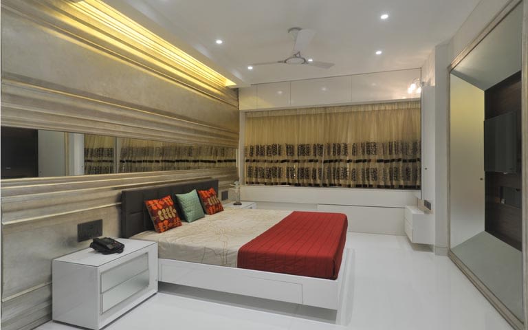 Modern gold and red themed bedroom decor by ARCHITECT KAUSHAL CHOUHAN Bedroom | Interior Design Photos & Ideas