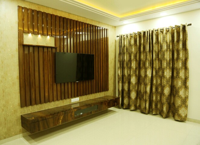 Golden theme modern TV cabinet decor by Amitus EPC Projects Pvt Ltd Living-room | Interior Design Photos & Ideas