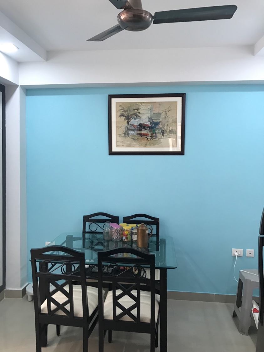 Simple Dining Space with Glass Top Table and Cushioned Wooden Chairs by Ar. Barkha Jain Dining-room Modern | Interior Design Photos & Ideas
