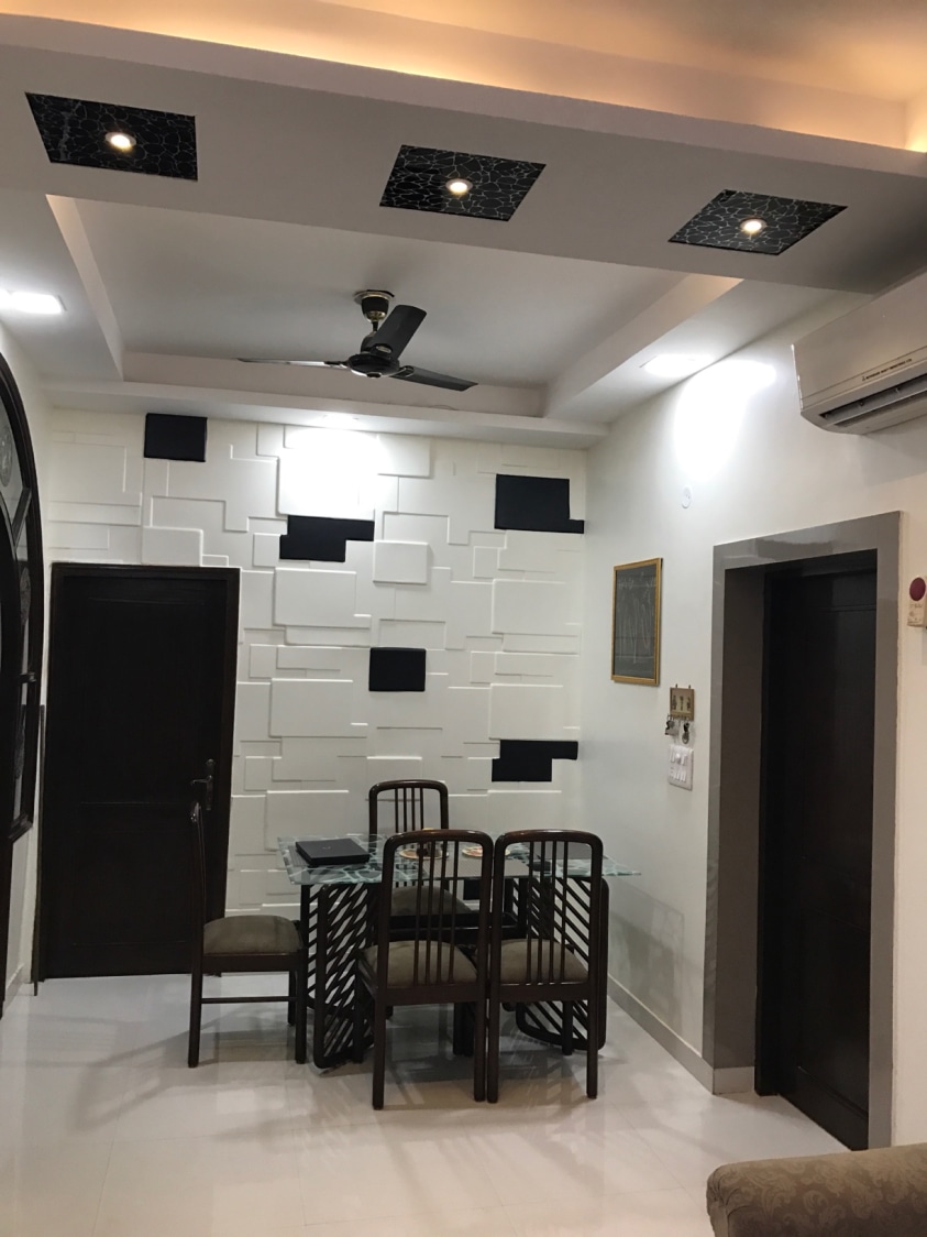 Dining Room with Cushioned Chairs and Edgy Wall Art by Ar. Barkha Jain Dining-room Modern | Interior Design Photos & Ideas