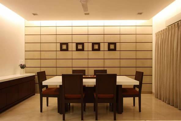 An Elegant Dining Room With Tank Beige Walls And Wooden Furniture by Megha Jain Dining-room Modern | Interior Design Photos & Ideas