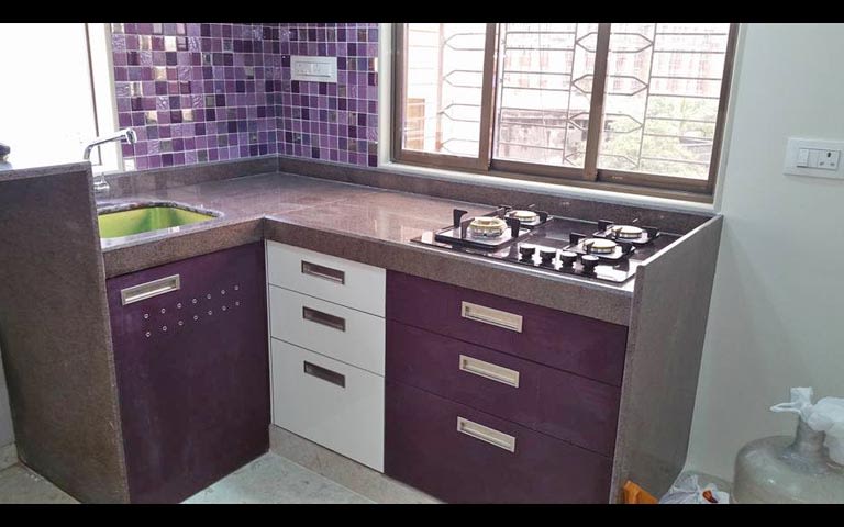 L-shaped modular kitchen with a purple theme by Burhani Design Studio Modular-kitchen Modern | Interior Design Photos & Ideas