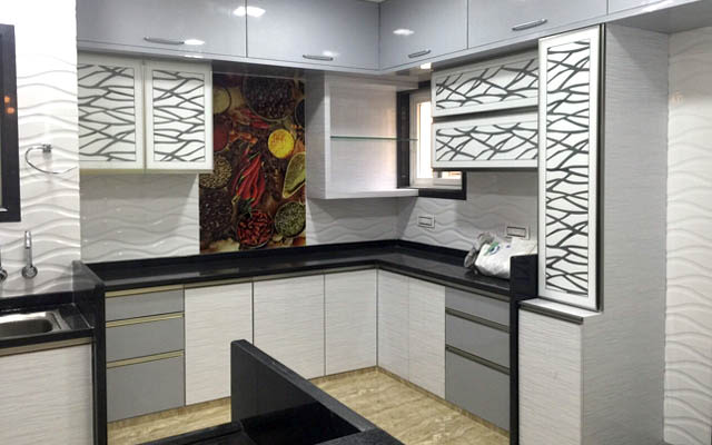L-shaped Modular Kitchen With Modern Abstract Patterned Cabinets by Vikesh M Sheth Modular-kitchen Modern | Interior Design Photos & Ideas