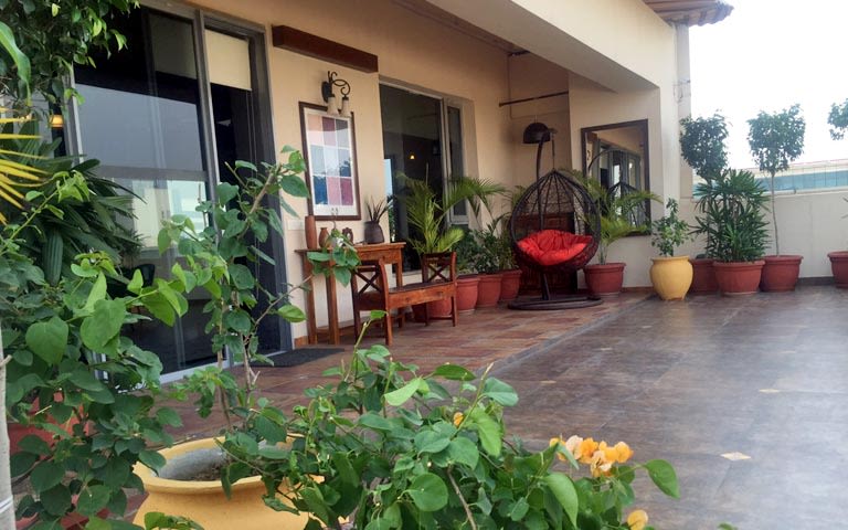 Veranda Decor With Wooden Tiles and Porch Chair by Ram Malhotra Open-spaces Modern | Interior Design Photos & Ideas