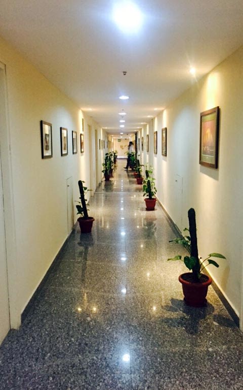 Hallway With Black Marble Floor and Soft Lighting by Ram Malhotra Indoor-spaces Modern | Interior Design Photos & Ideas