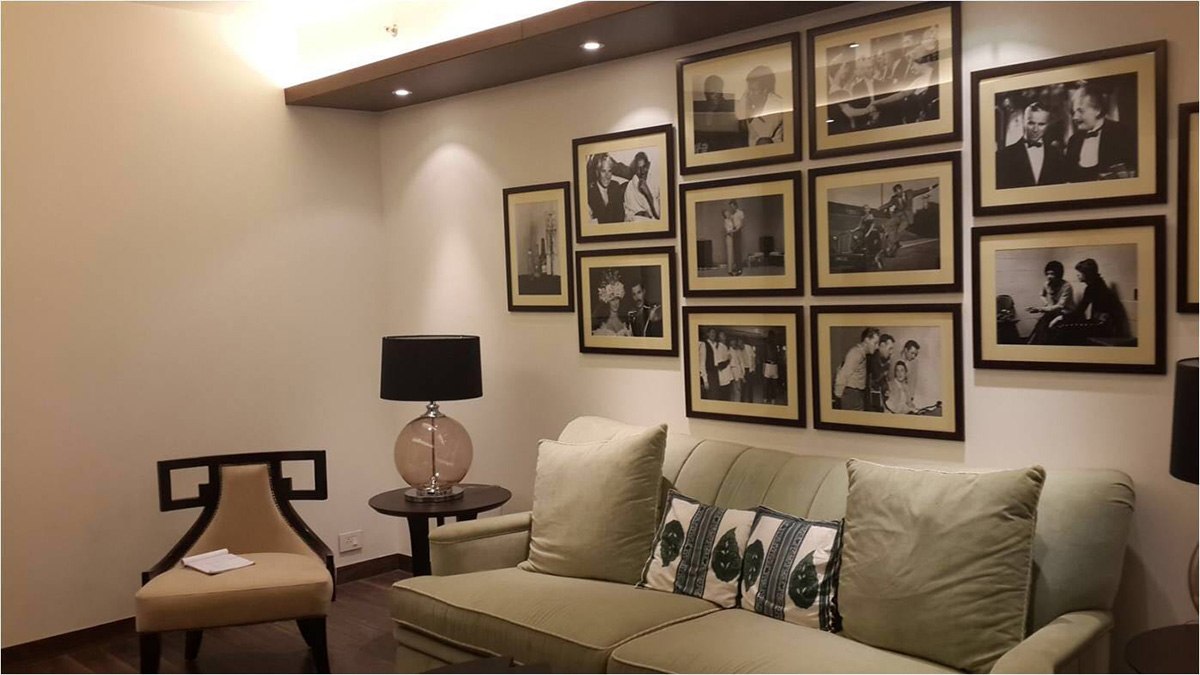 Tan Colored Velvet Sofa With Pictures on Wall by Ram Malhotra Modern | Interior Design Photos & Ideas
