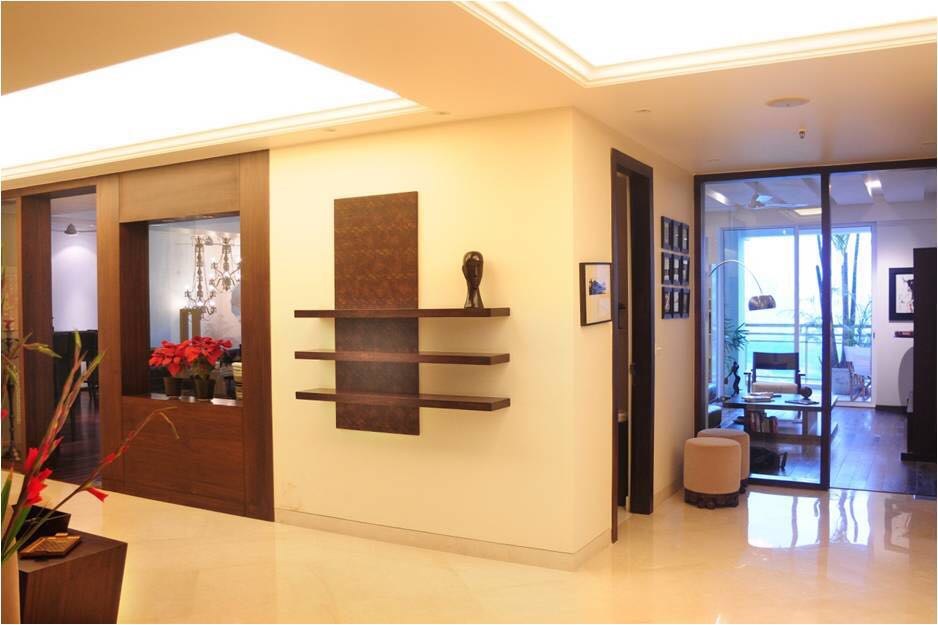 Beige Themed Living Room With Wooden Display Shelf by Ram Malhotra Living-room Modern | Interior Design Photos & Ideas