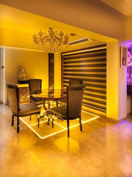 Modern dining room decor with lights by Blue Arch Interiors Dining-room | Interior Design Photos & Ideas