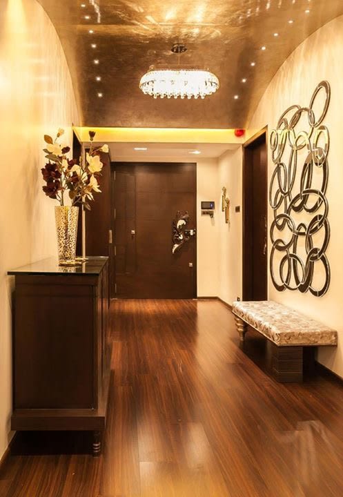 Plush wooden finish entrance by Blue Arch Interiors Indoor-spaces | Interior Design Photos & Ideas