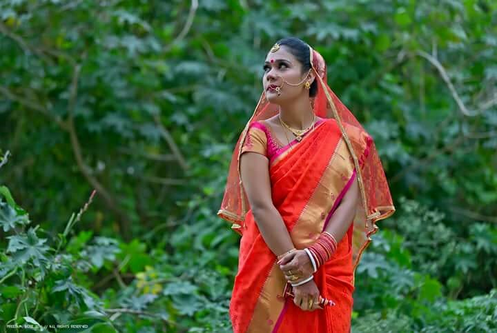 The quirky bride posing in a red saree by Pixelpeppermint Wedding-photography | Weddings Photos & Ideas