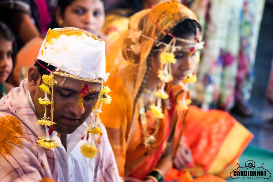 Bride And Groom With Marigold Head Gear by Sandesh Wedding-photography Bridal-jewellery-and-accessories Groom-wear-and-accessories | Weddings Photos & Ideas