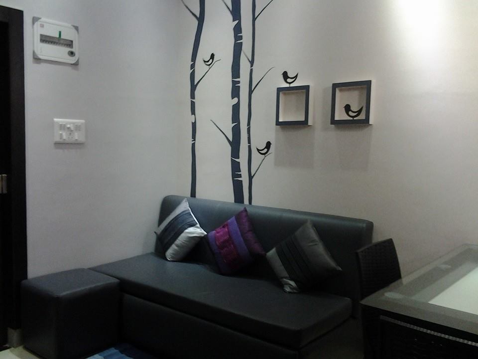 Living Room With Black Leather Sofa And Wall Art by Snigdha Ghosh Bedroom Contemporary | Interior Design Photos & Ideas