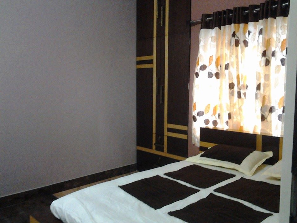 Simple Bedroom With Dark Walnut Wooden Wardrobe by Snigdha Ghosh Bathroom Contemporary | Interior Design Photos & Ideas