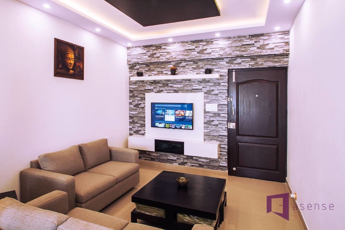Living Room With Mustard Sofas And Brick Wall by Snigdha Ghosh Living-room Contemporary | Interior Design Photos & Ideas