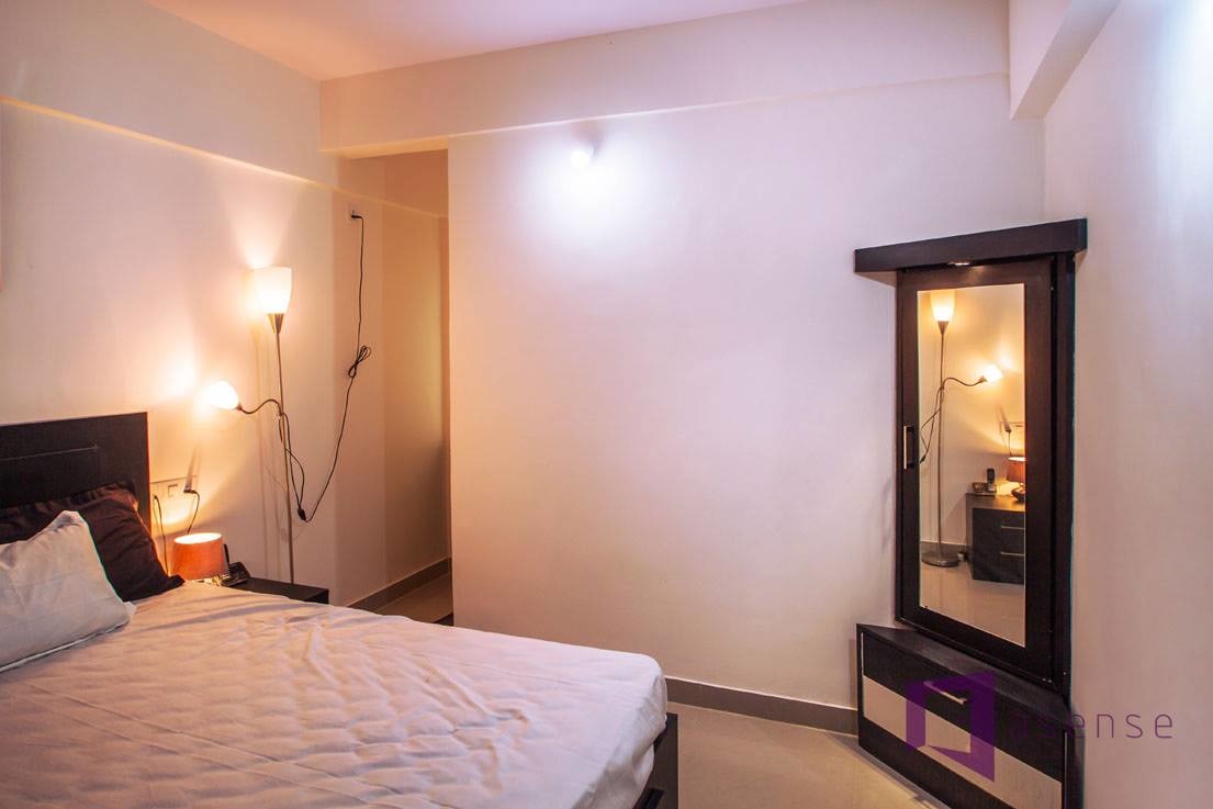 Wooden Cushioned Bed With Yellow Beautiful Lights by Snigdha Ghosh Bedroom Contemporary | Interior Design Photos & Ideas