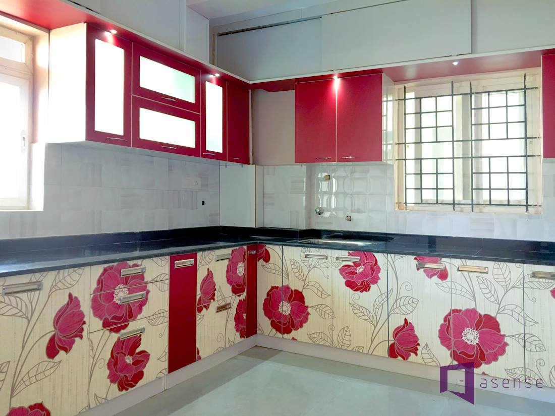 The kitchen with red by Asense Interior