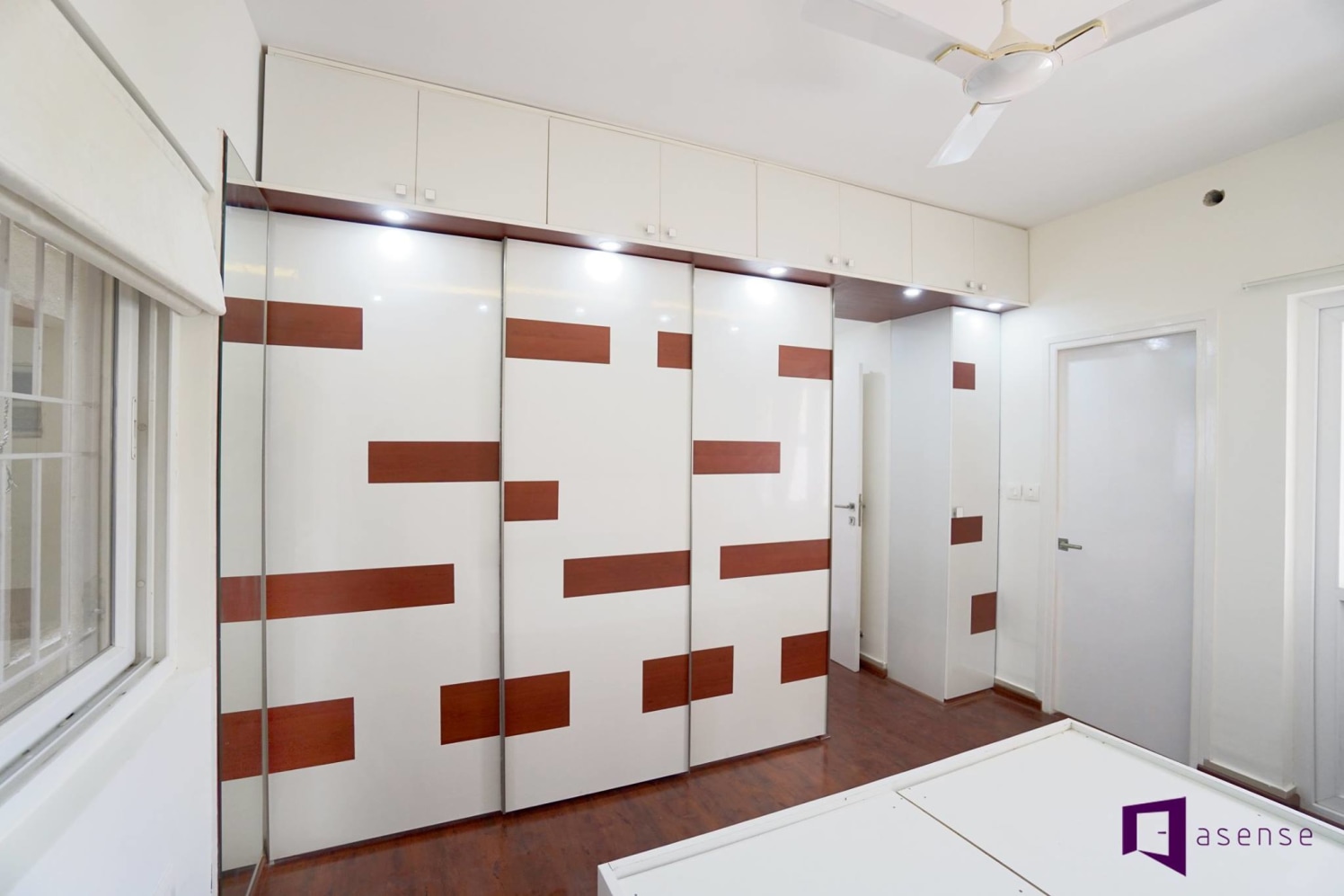White Wardrobe With Brown Strips by Snigdha Ghosh Bedroom Contemporary | Interior Design Photos & Ideas