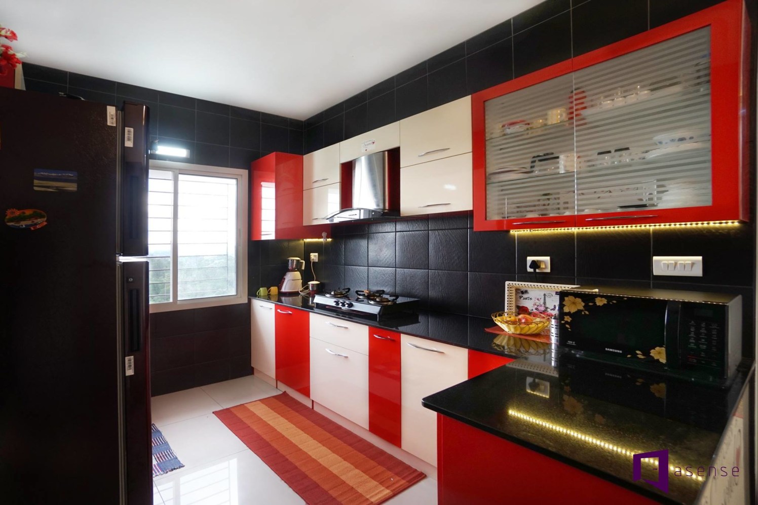Red And White Themed Modular Kitchen with Black Marbles by Snigdha Ghosh Modular-kitchen Contemporary | Interior Design Photos & Ideas
