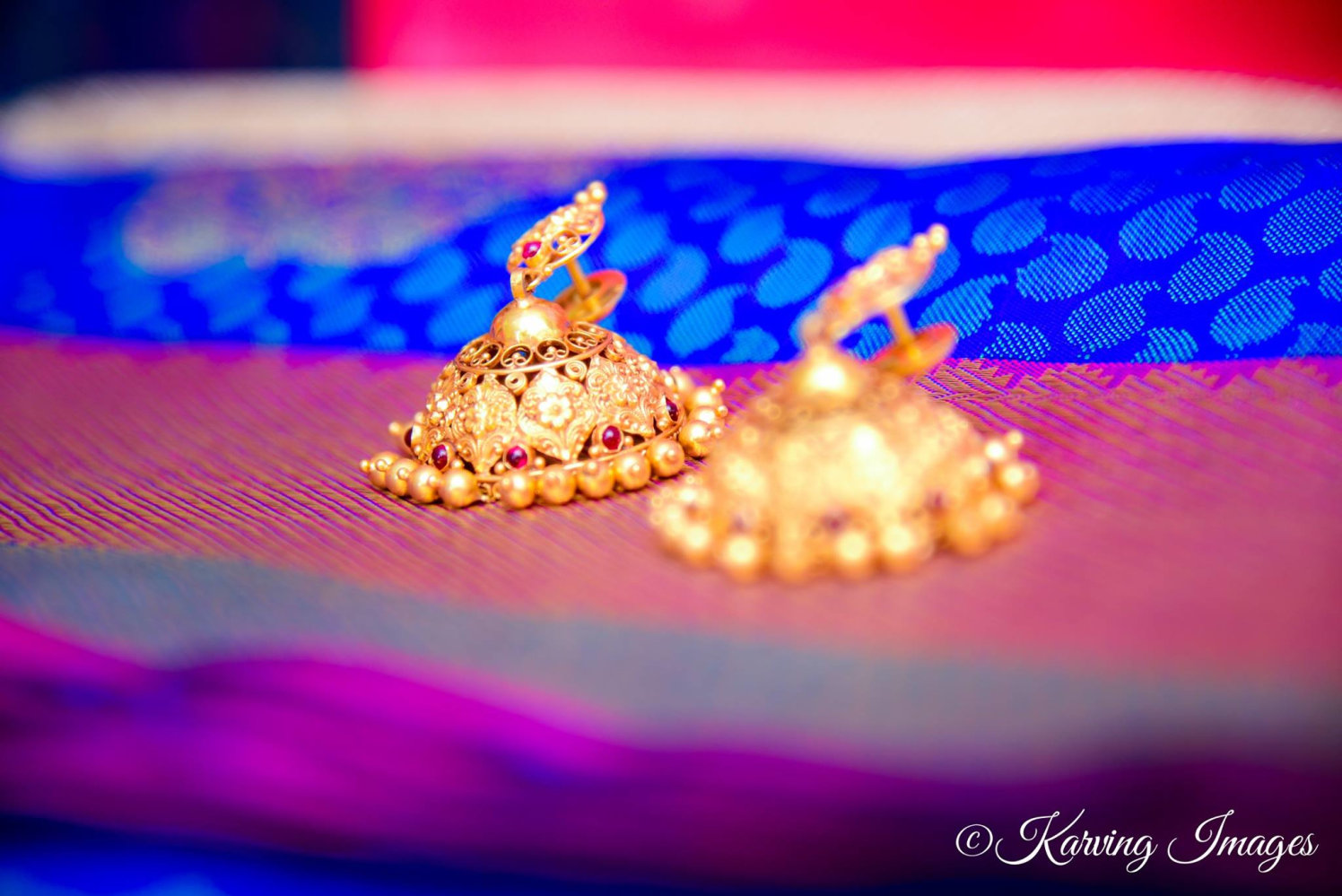 Intricate gold jhumkas for brides by Karving Images Wedding-photography | Weddings Photos & Ideas