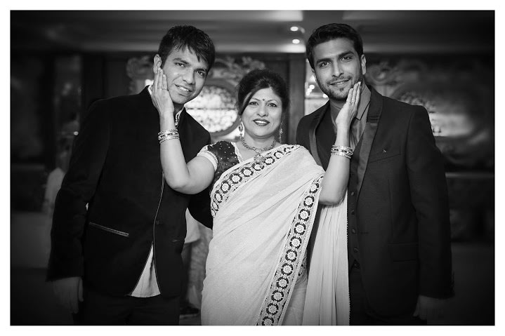 Groom Posing With His Family by Himanshu Chauhan Wedding-photography | Weddings Photos & Ideas