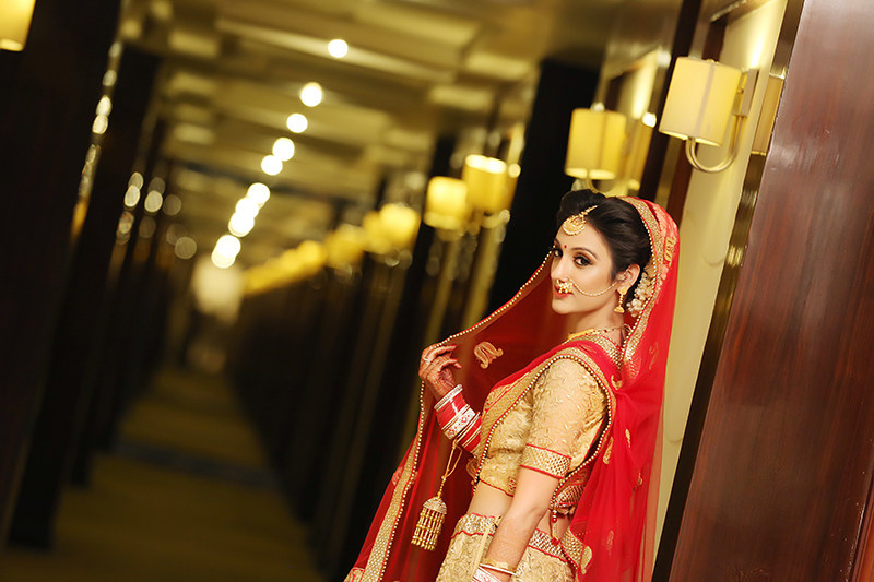 Bride Wearing A Red And Gold Bridal Lehenga by Mukesh bijalwan Wedding-photography | Weddings Photos & Ideas