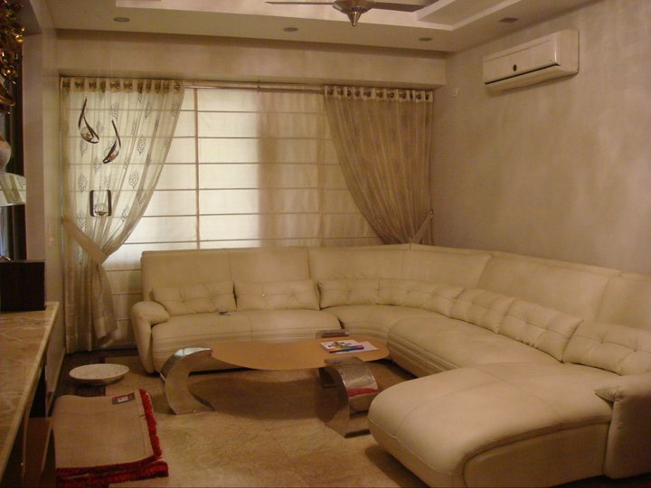 A contemporary living room with cream coloured furniture by Reform Design Living-room | Interior Design Photos & Ideas