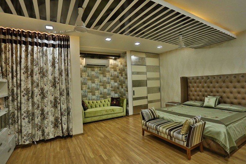 Bedroom WIth Wooden Flooring And False Ceiling With Black And White Stripes by Damanjit Bajaj Bedroom Contemporary | Interior Design Photos & Ideas