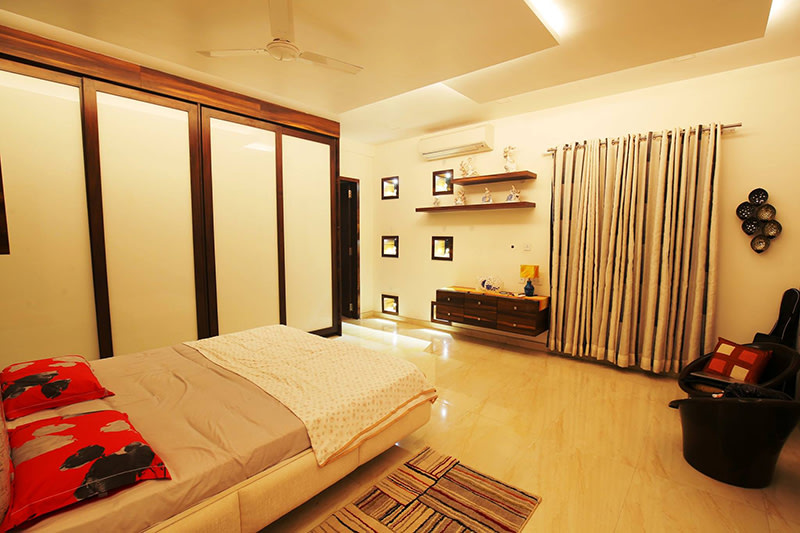 White Cushioned Bed With Shifting Wardrobe by Kraftworks Pvt. Ltd. Bedroom | Interior Design Photos & Ideas