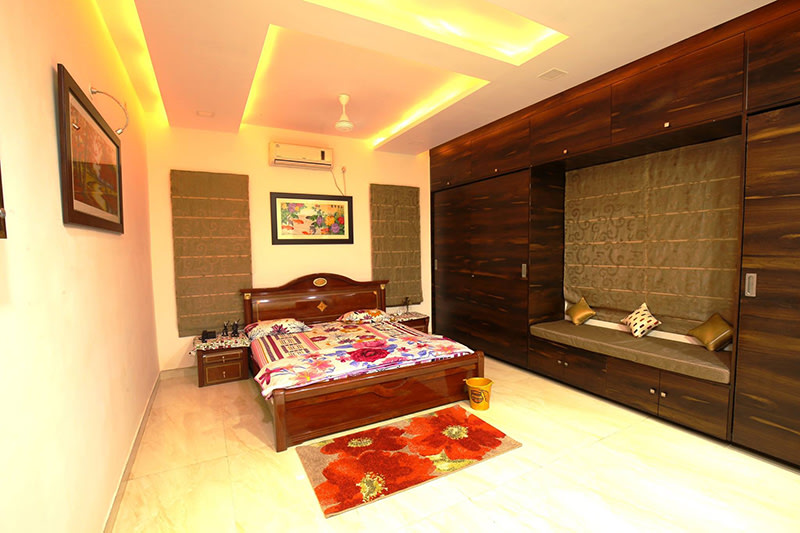 A standard master bedroom with marble flooring and false ceilings by Kraftworks Pvt. Ltd. Bedroom | Interior Design Photos & Ideas