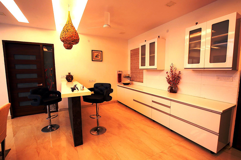 Parallel Modular Kitchen With Antique Hanging Lights by Kraftworks Pvt. Ltd. Living-room | Interior Design Photos & Ideas