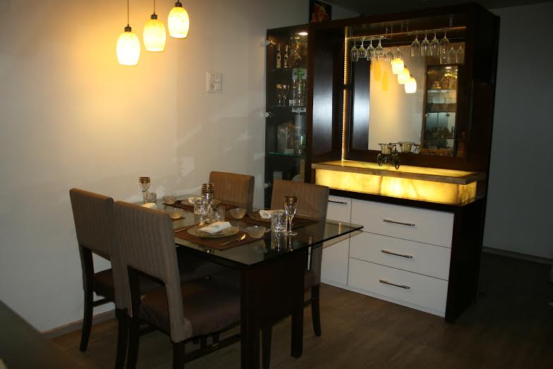 The dining table with home bar beside by E- Studio Traditional | Interior Design Photos & Ideas
