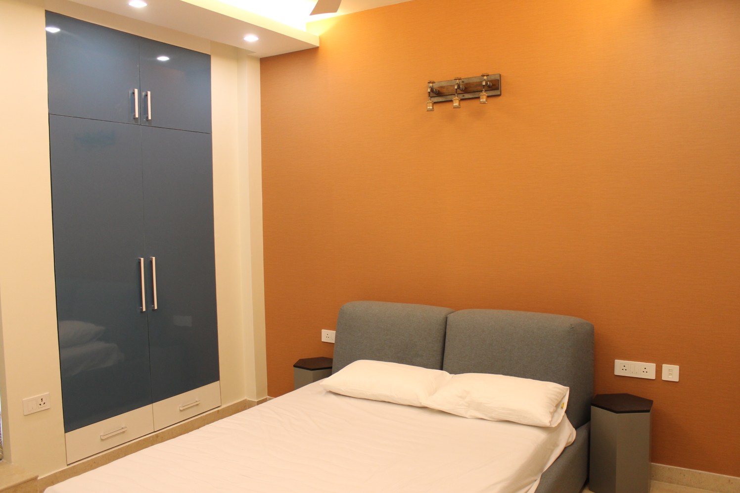 bedroom with orange walls by coalitiondesigns Bedroom Modern | Interior Design Photos & Ideas